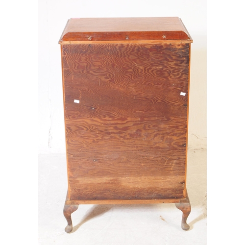 1040 - An early 20th Century circa 1930s arts and crafts oak four drawer chest of drawers having hand carve... 