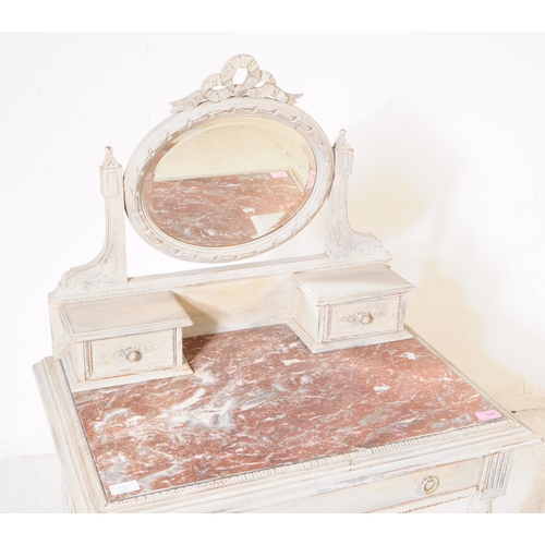 1045 - A Louis XVI style marble topped mirror back dressing table. The dressing table raised on tapered flu... 