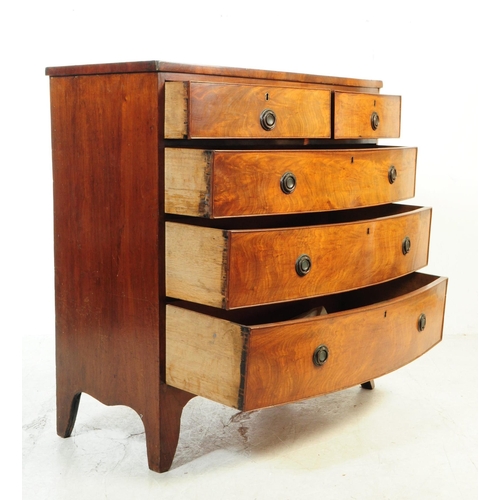 1049 - A 19th century George III bow front mahogany chest of drawers. The chest having a four drawer config... 