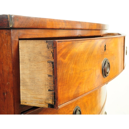 1049 - A 19th century George III bow front mahogany chest of drawers. The chest having a four drawer config... 