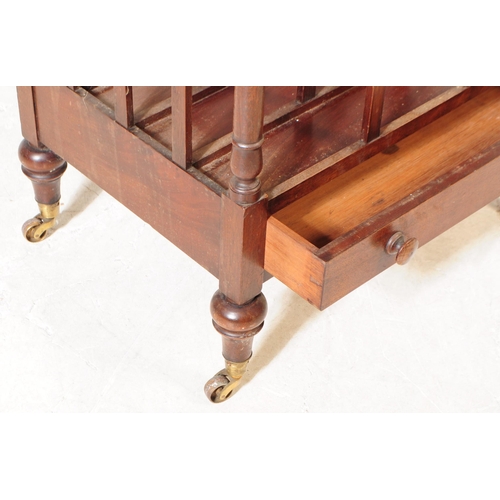 1050 - A Victorian 19th century mahogany Canterbury bookcase / magazine rack stand. Having pierced heart to... 