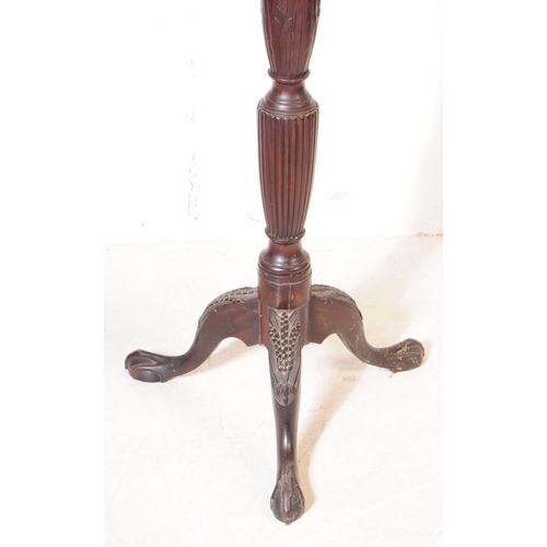 1056 - A 19th Century Victorian mahogany torchere / plant stand. Having circular platform to top and reeded... 