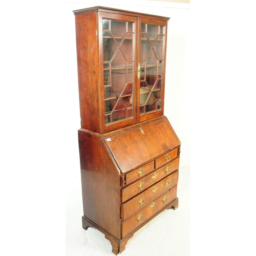 1059 - A 18th century George III mahogany library bookcase. The bookcase having astragal glazed twin doors ... 