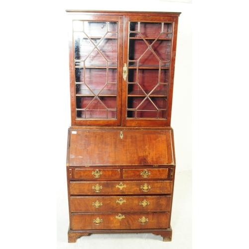 1059 - A 18th century George III mahogany library bookcase. The bookcase having astragal glazed twin doors ... 