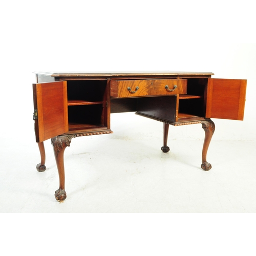 1063 - An early 20th Century circa 1920s Queen Anne Revival mahogany desk with leather inlay top. Desk havi... 