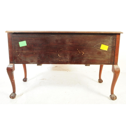 1063 - An early 20th Century circa 1920s Queen Anne Revival mahogany desk with leather inlay top. Desk havi... 