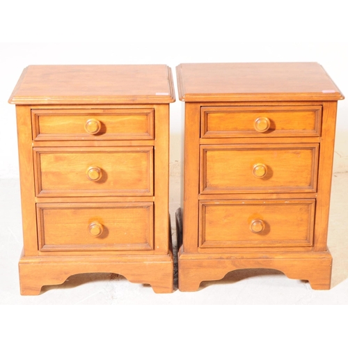 1066 - A pair of 20th century hardwood bedside pedestal chest of drawers. Each having chamfered top over a ... 