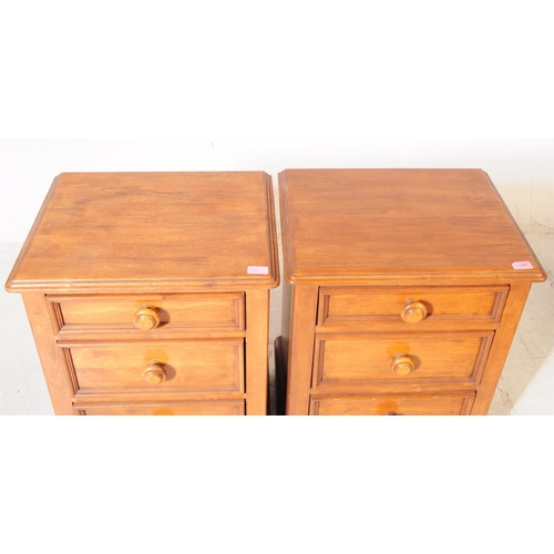 1066 - A pair of 20th century hardwood bedside pedestal chest of drawers. Each having chamfered top over a ... 