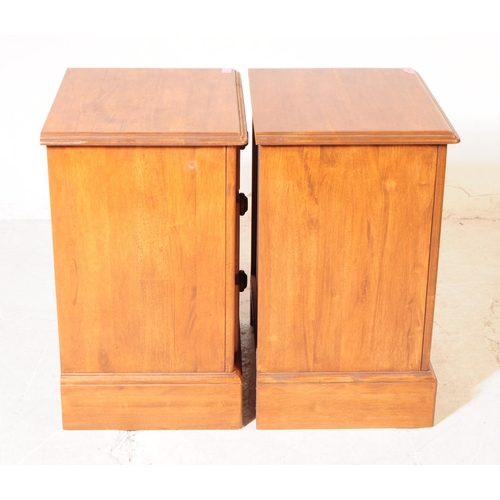 1066 - A pair of 20th century hardwood bedside pedestal chest of drawers. Each having chamfered top over a ... 