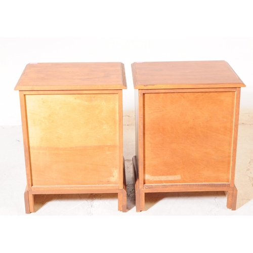 1066 - A pair of 20th century hardwood bedside pedestal chest of drawers. Each having chamfered top over a ... 