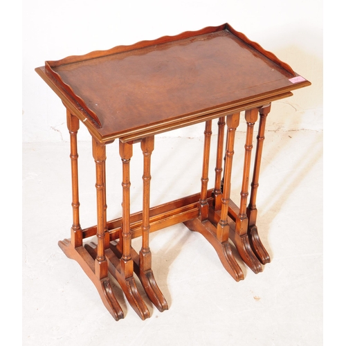 1071 - An early 20th century Edwardian repro mahogany inlaid nest of side tables. The tables each having to... 