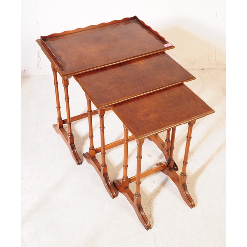 1071 - An early 20th century Edwardian repro mahogany inlaid nest of side tables. The tables each having to... 