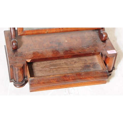 1076 - A 19th Century Victorian mahogany veneer swing toilet mirror. The rectangular mirror having splayed ... 