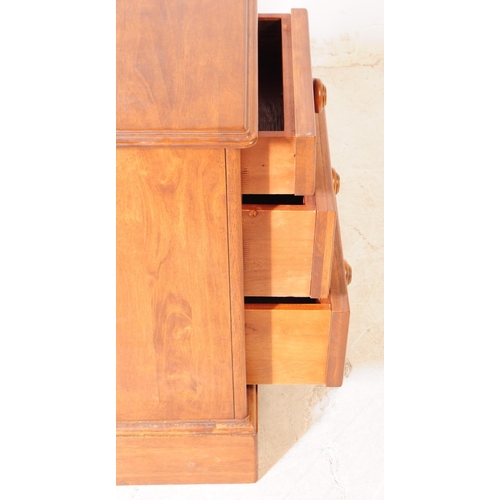 1077 - A pair of 20th century hardwood bedside pedestal chest of drawers. Each having chamfered top over a ... 