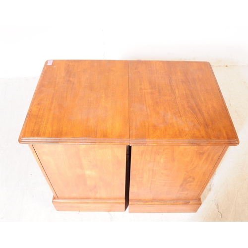 1077 - A pair of 20th century hardwood bedside pedestal chest of drawers. Each having chamfered top over a ... 