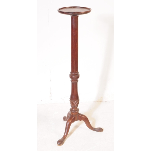 1078 - A 19th Century Victorian mahogany torchere / plant stand. Having circular table top upon rounded tur... 