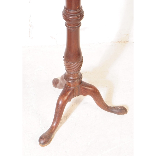 1078 - A 19th Century Victorian mahogany torchere / plant stand. Having circular table top upon rounded tur... 