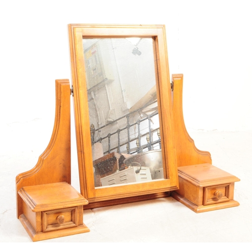 1081 - A 20th century hardwood dressing chest. The chest of drawers having mirror to top flanked by trinket... 