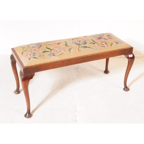 1084 - A 1930s 20th century piano duet needlepoint upholstered footstool with another. The larger footstool... 