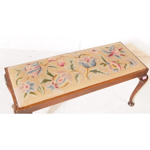 1084 - A 1930s 20th century piano duet needlepoint upholstered footstool with another. The larger footstool... 