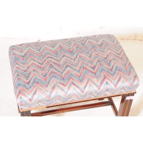 1084 - A 1930s 20th century piano duet needlepoint upholstered footstool with another. The larger footstool... 