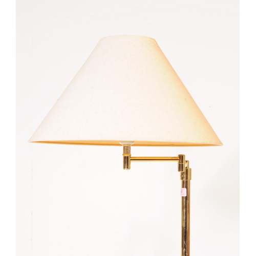 1087 - Two 20th century brass adjustable swing arm floor standing standard lamps. The lamps each raised on ... 