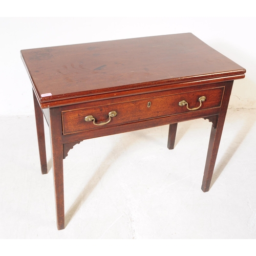 1093 - A 19th century George III mahogany fold over tea table. The desk having rectangular top over drawers... 