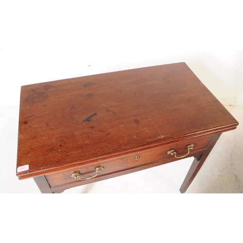 1093 - A 19th century George III mahogany fold over tea table. The desk having rectangular top over drawers... 