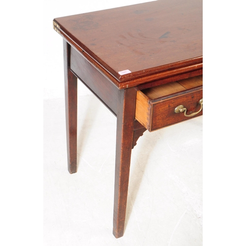 1093 - A 19th century George III mahogany fold over tea table. The desk having rectangular top over drawers... 