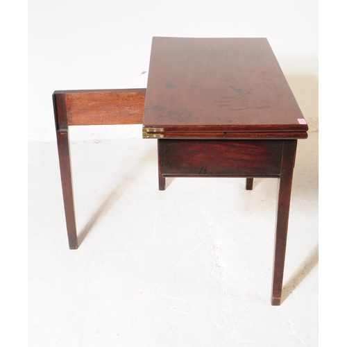 1093 - A 19th century George III mahogany fold over tea table. The desk having rectangular top over drawers... 