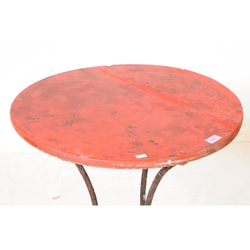 1096 - An early 20th century side table. The table having red lacquered circular top over metal tripod base... 