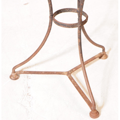 1096 - An early 20th century side table. The table having red lacquered circular top over metal tripod base... 