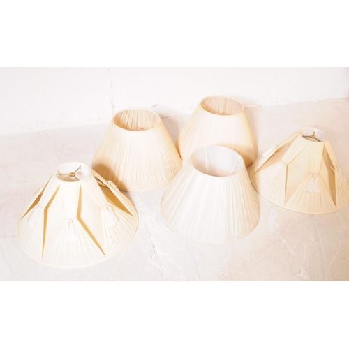 1099 - A collection of five 20th century cream silk lamp light shades. The shade all being of Pembroke empi... 