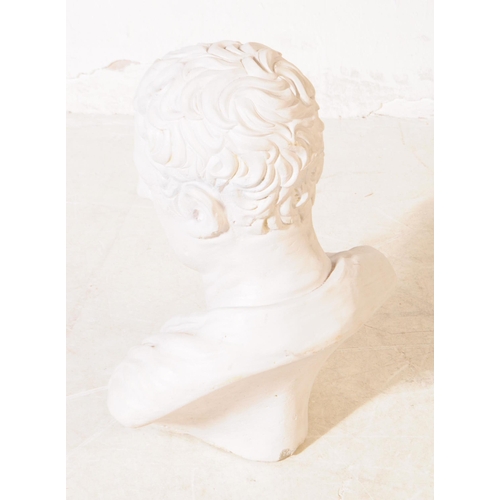 1100 - A large 20th century composite bust modelled in the form of a Roman emperor with robes clasped by fi... 