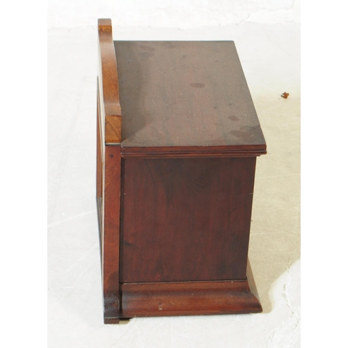 1103 - An early 20th century mahogany wall hanging cabinet. The cabinet having gallery back with single doo... 