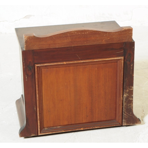 1103 - An early 20th century mahogany wall hanging cabinet. The cabinet having gallery back with single doo... 