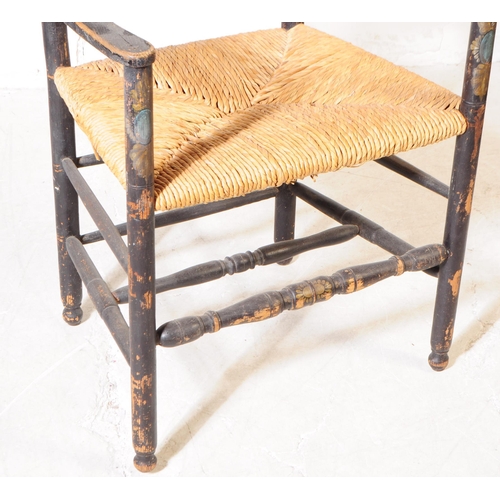 1104 - An 19th century Chinoiseries black lacquered Arts and Crafts carver chair having ladder back with ru... 