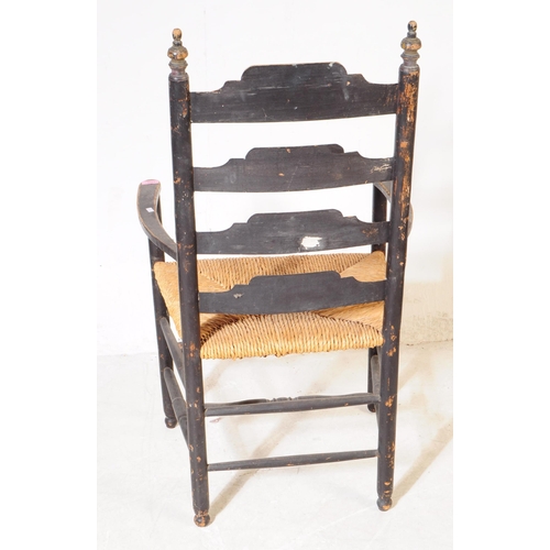 1104 - An 19th century Chinoiseries black lacquered Arts and Crafts carver chair having ladder back with ru... 