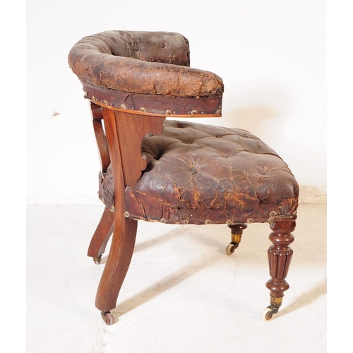 1105 - A 19th century mahogany cockfighting bow chair having a tufted leather top rail over carved lyre sha... 