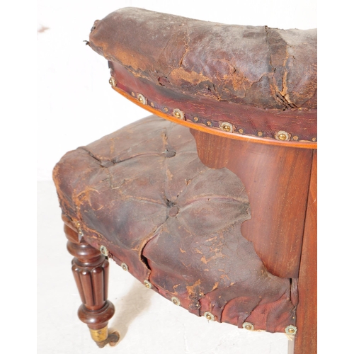 1105 - A 19th century mahogany cockfighting bow chair having a tufted leather top rail over carved lyre sha... 