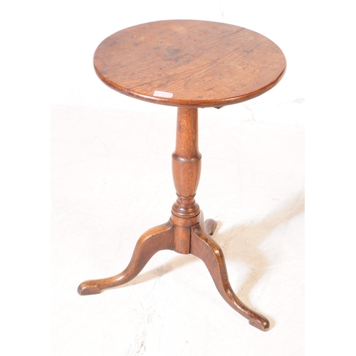 1107 - A pair of 19th century George III mahogany and oak pedestal wine tables. Each having circular tops o... 