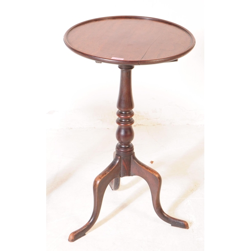 1107 - A pair of 19th century George III mahogany and oak pedestal wine tables. Each having circular tops o... 