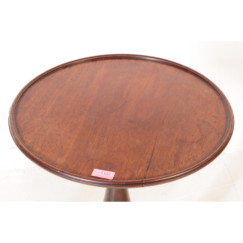 1107 - A pair of 19th century George III mahogany and oak pedestal wine tables. Each having circular tops o... 