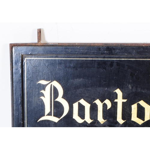 1110 - An early 20th century painted hanging sign for Barton House. The sign having back background with gi... 