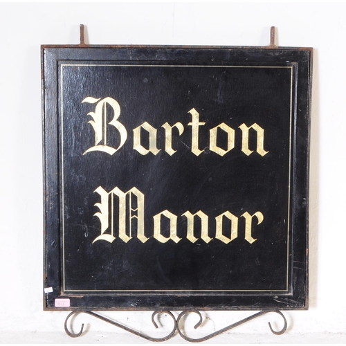 1110 - An early 20th century painted hanging sign for Barton House. The sign having back background with gi... 