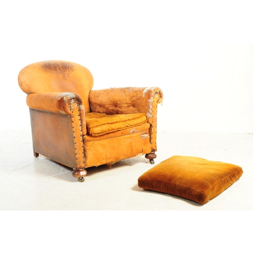 1117 - An early 20th century Howards manner club armchair. The chair having shaped backrest over deep seat ... 