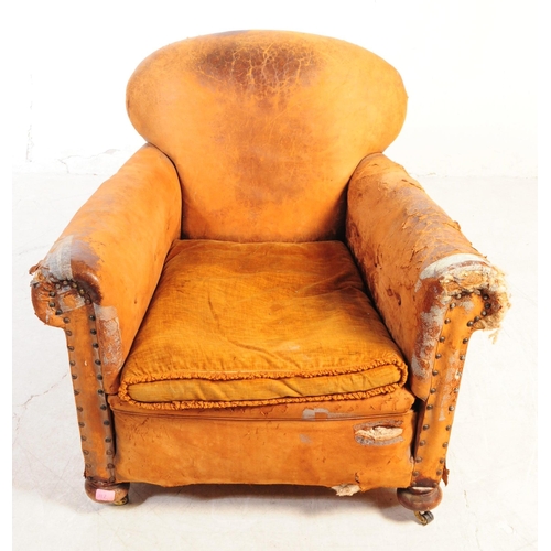 1117 - An early 20th century Howards manner club armchair. The chair having shaped backrest over deep seat ... 