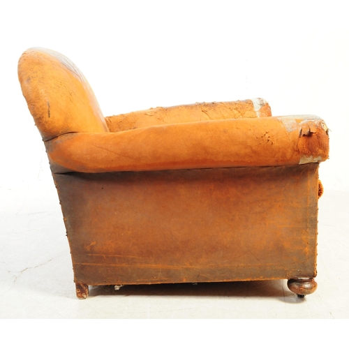 1117 - An early 20th century Howards manner club armchair. The chair having shaped backrest over deep seat ... 