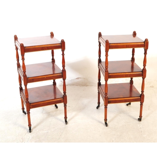 1119 - A pair of 20th century Victorian Revival lamp stands / side tables. Each table raised on castors, ha... 