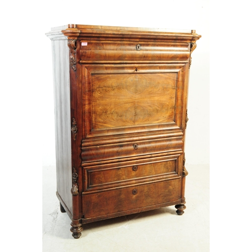 1124 - A 19th century Biedermeier walnut secretaire abittant desk. The secretaire raised on turned bun feet... 